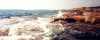 Waves on the rocks in summertime